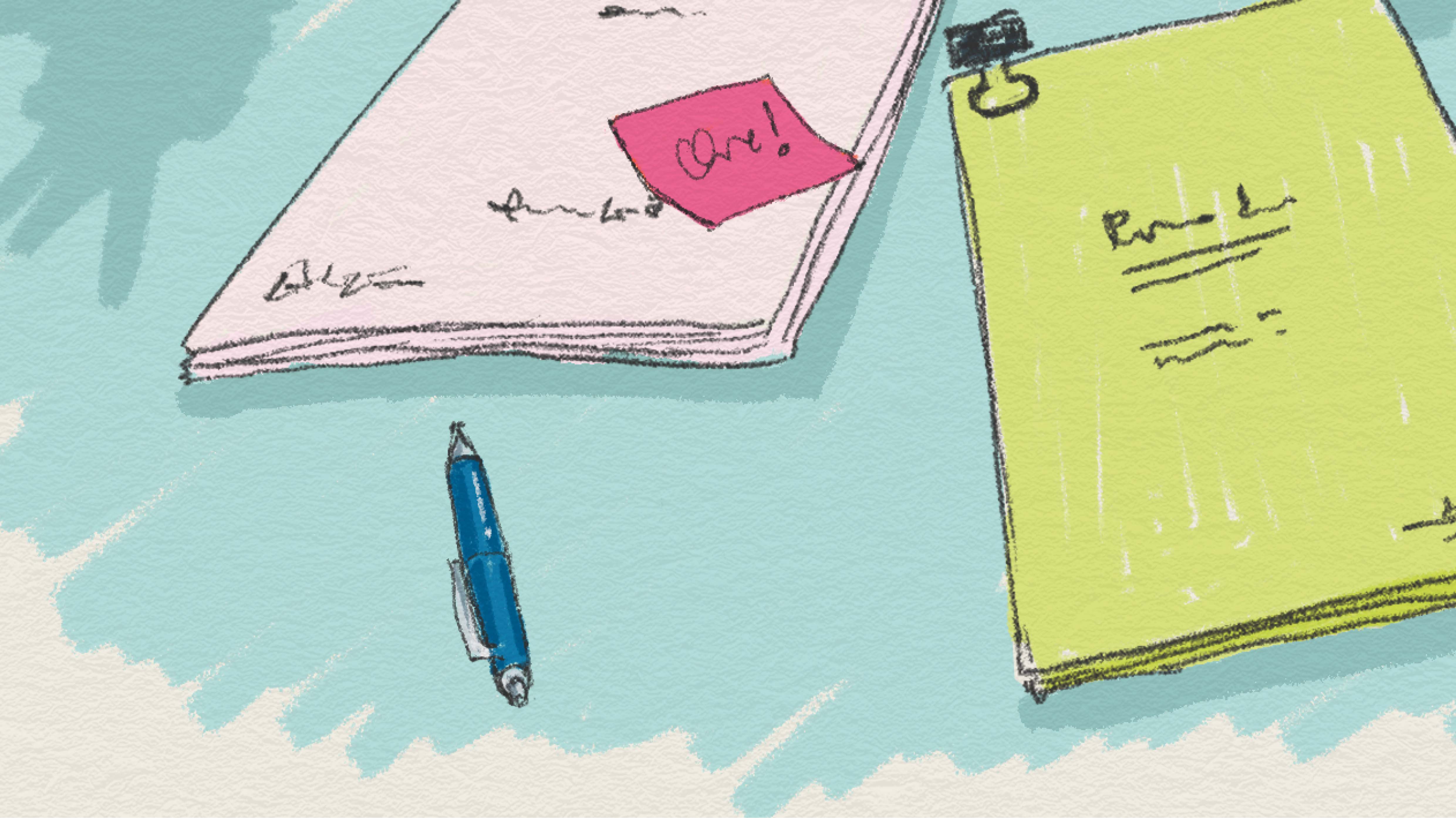 Penna och skrivblock på ett bord