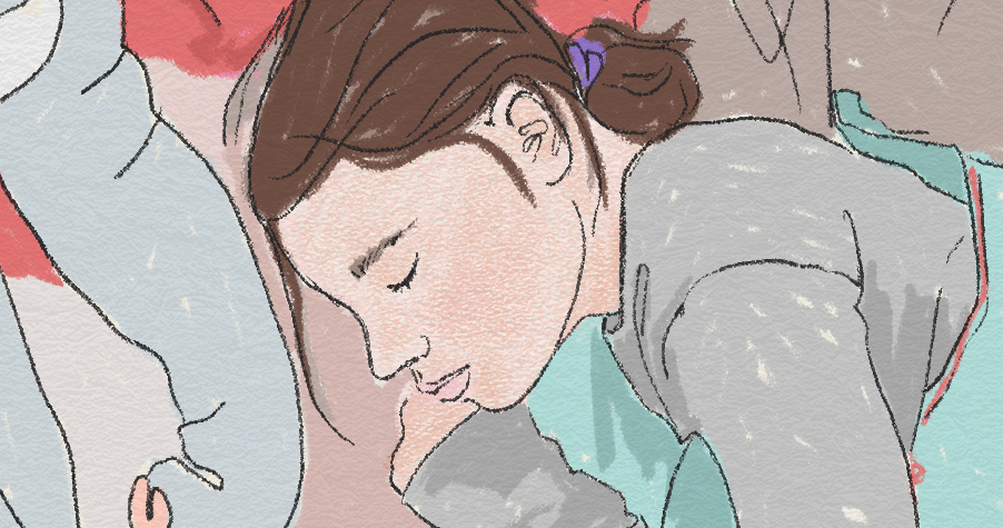 En person ligger och sover under täcket