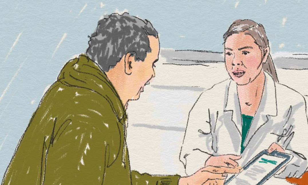 Två personer mitt emot varandra, en ser ut att vara läkare